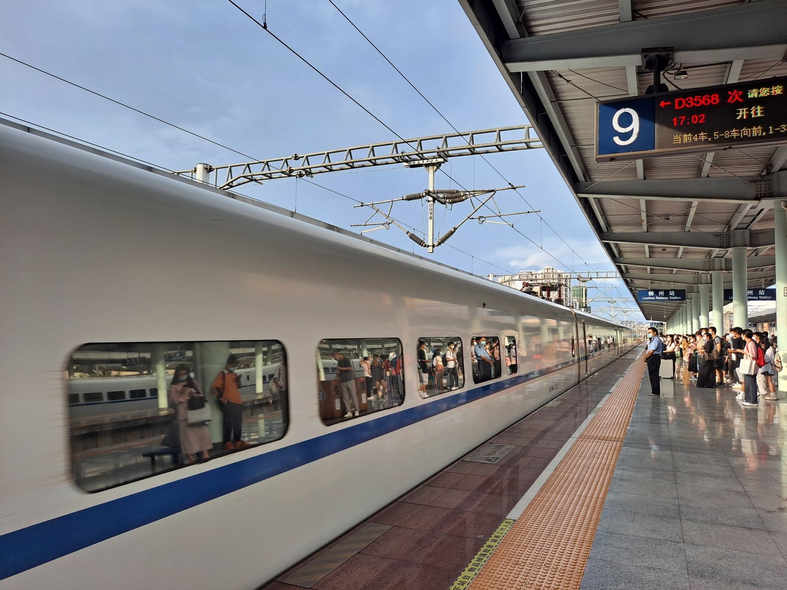 High-speed train and platform signage at Liuzhou Railway Station
