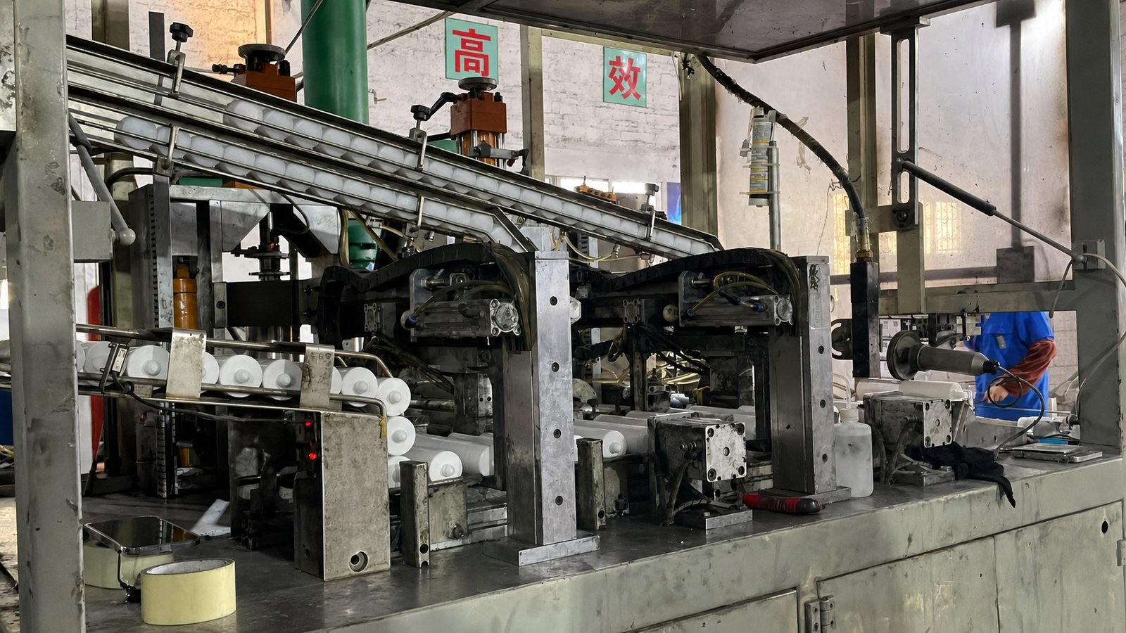 Unbranded cartridges moving through a factory production line