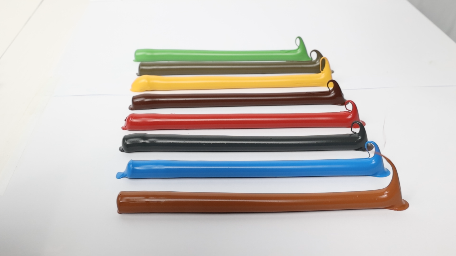 Extruded sealant samples in multiple colors arranged for visual comparison