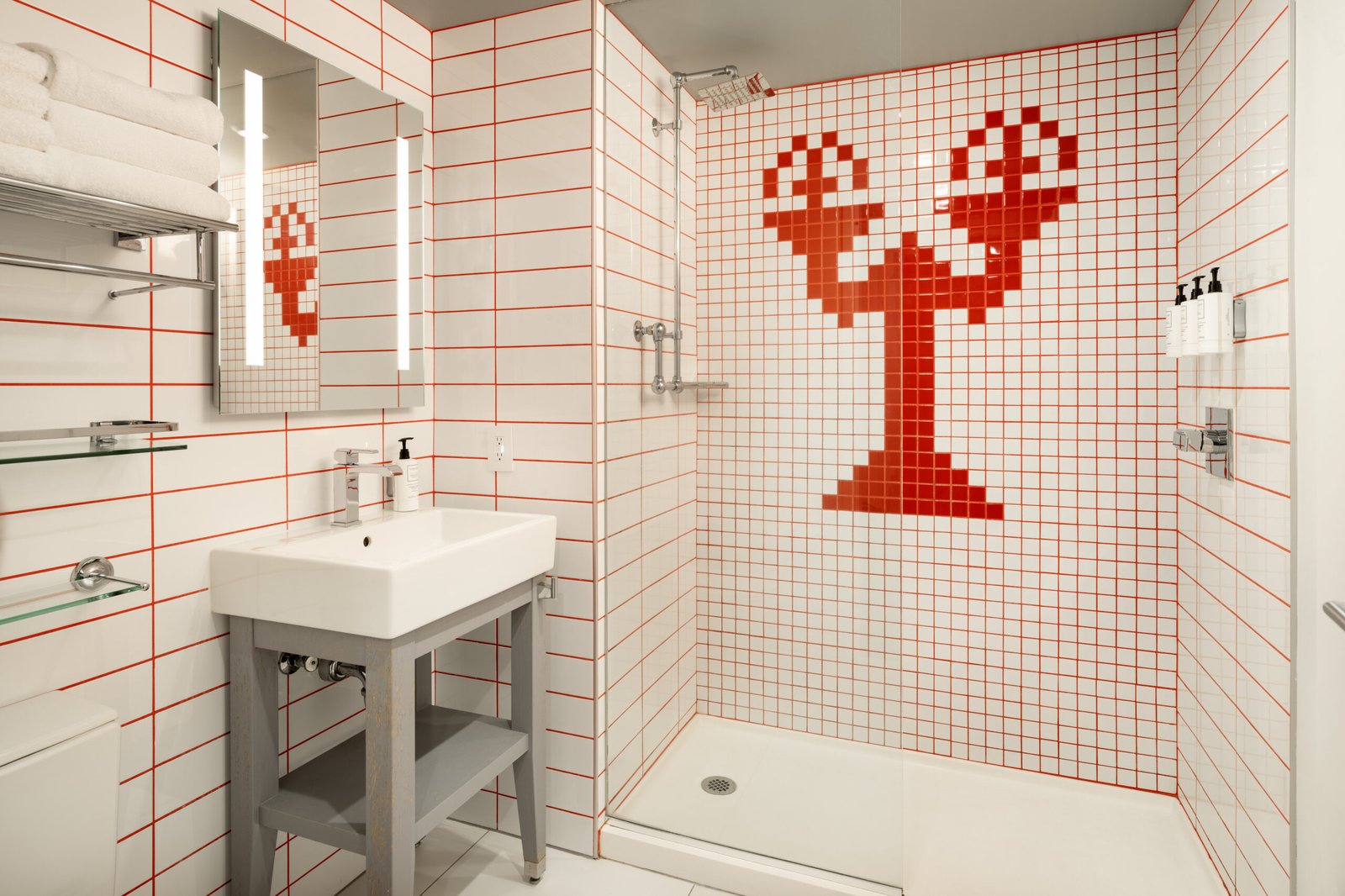 A tiled shower and vanity in an indoor bathroom wet area.