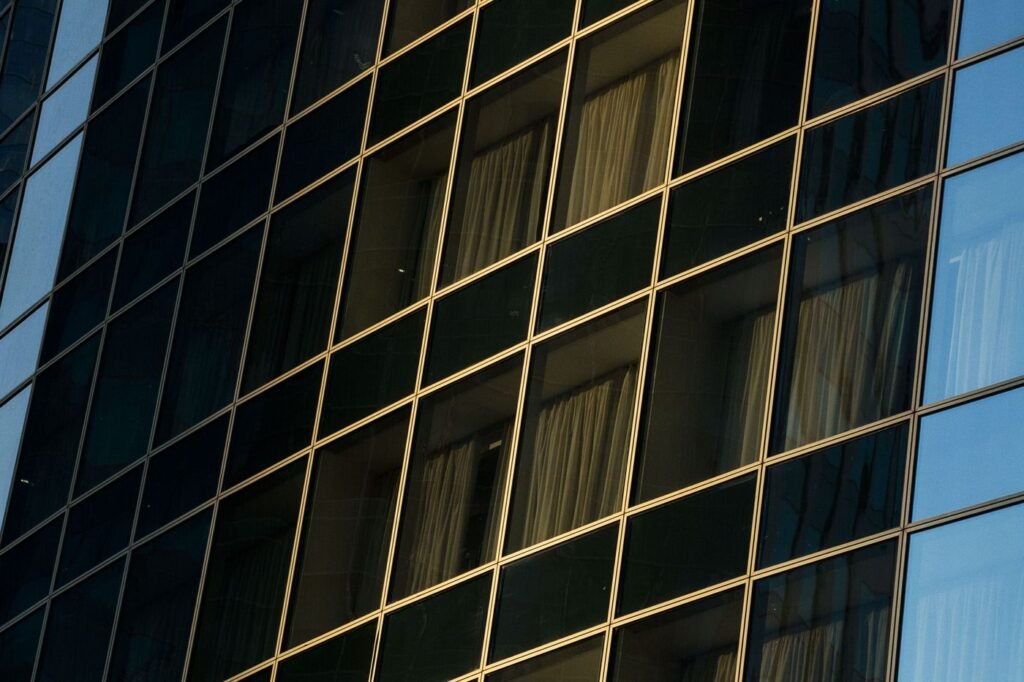 Architectural glass and metal panels divided by clean joint lines.